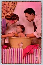 Real photo hand colored postcard c1950 Mother Father & baby in bathtub picture