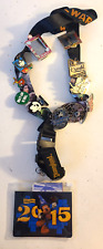 Lot of 12 Disney Pins, STARWARS Lanyard, 2015 pin holder, and 4 different passes picture