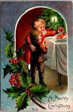 Christmas PC Two Children Reaching For Food on a Plate Candlelit Tree Holly picture