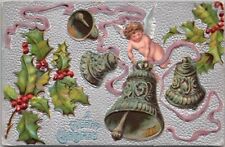 1909 CHRISTMAS Embossed Postcard Flying Baby Angel with Silver Bells / Holly picture