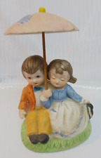 Vintage Figurine Deville Boy and Girl sitting and holding Umbrella  picture