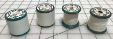 vintage green wood spools with thread white picture