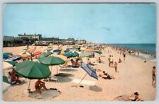 1962 RELAXING & PLAYING AT REHOBOTH BEACH DELAWARE BEACH SCENE POSTCARD picture