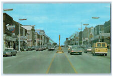 c1950's Cars, Hotel, Restaurant, Pharmacy, Book Store Marshfield WI Postcard picture