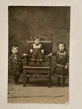 1902 Brother & Sisters Cute Toddler on Chair  Real Photo Vintage Postcard RPPC picture