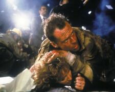 Die Hard 1988 Bruce Willis as John McClane protects Holly Bonnie Bedelia Poster picture