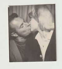 VINTAGE PHOTO BOOTH - AFFECTIONATE, ATTRACTIVE YOUNG COUPLE, KISSING picture