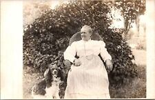Vintage RPPC Postcard- Woman in Vintage Dress -Sitting In Chair With Spaniel picture