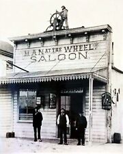 ANTIQUE OLD WEST REPRODUCTION  8X10 PHOTOGRAPH PRINT OF MAN AT THE WHEEL SALOON picture