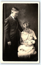 c1910 YOUNG COUPLE WITH CUTE SMILING NEWBORN BABY STUDIO AZO RPPC POSTCARD P4254 picture