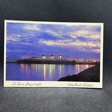 Vintage Postcard Of The Queen Mary At Night Long Beach CA Photo By Ted Schmoll picture