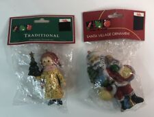 Lot of 2 Trim a Tree Christmas Ornaments Girl with Tree & Santa Resin 4 Inches picture