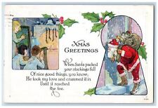 c1920's Christmas Greetings Santa Claus Sack Of Toys Fireplace Stocking Postcard picture
