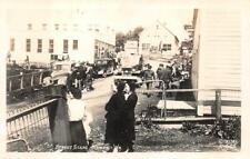 RPPC STREET SCENE KODIAK ALASKA CARS & SIGNAGE REAL PHOTO POSTCARD (c. 1940s) picture