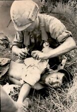 LG52 1967 Wire Photo U.S. ARMY MEDIC TREATS VIETNAMESE MAN INJURED VIETNAM WAR picture