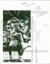 1991 Press Photo Lyman DePriest of CT loses rebound to Tom Gugliotta, NC State picture