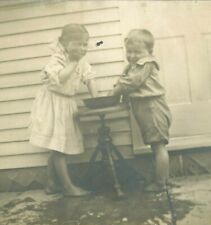 RPPC Girl and Boy Playing With Water Real Photo Postcard picture
