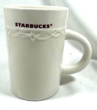 2010 STARBUCKS HOLIDAY COFFEE CUP MUG EMBOSSED IVORY DESIGN 10 OZ picture