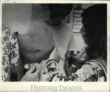 1974 Press Photo Sullivan lets sister Patty have last lock of hair at barbers. picture