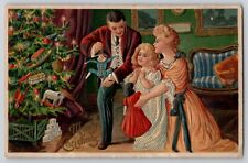 Christmas Postcard Victorian Edwardian Family Girl Tree Candles Toys Doll 1910s picture