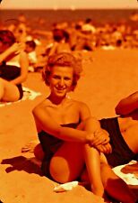 VTG 1950s 35MM SLIDE BEACH SCENE BLONDE SWIMSUIT SITTING ON SAND SMILING #17-13U picture
