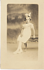 Postcard - RPPC Real Photo - Young Girl With White dress & Big Hair Ribbon picture