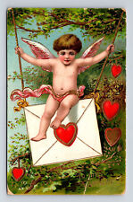 1914 Gel Coated Cupid Cherub Swinging on Love Letter Valentine's Day Postcard picture