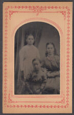 Three sisters 2 seated studio portrait tintype ca 1860s matted picture