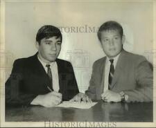 1969 Press Photo Wrestler Jules Plaisance signs letter with LSU coach Paul Katz picture