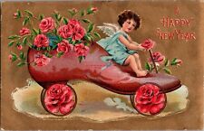 A Happy New Year Greetings Angel Riding Shoe Pink Roses Floral Embossed Postcard picture