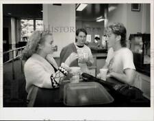 1989 Press Photo Deerfield Academy coed students talk in lunch area. - sra21858 picture