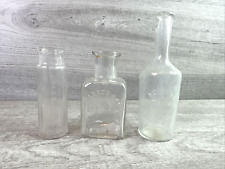Lot Of 3 Vintage Clear Embossed Quack Medicine/Lotion Bottles picture