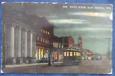 1913 East Merrill Wisconsin Street Scene & Trolley at Night Postcard picture