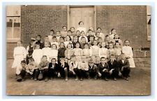 Postcard RPPC Unidentified Schoolchildren Teacher c1910 in Front of Brick Bldg picture