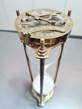 vintage maritime brass sand timer hourglass with sundial compass on top picture