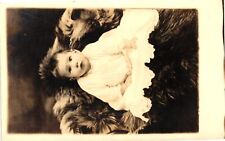 VTG Postcard- A baby on a fur. Early 1900s RPPC picture