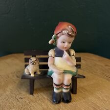 Vintage Plastic Figurine Girl With Dog Sitting on Bench picture