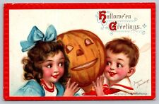 Postcard Halloween Greetings Boy Girl Hug Jack-O-Lantern Red Border Brundage picture
