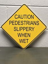 Caution Pedestrians Slippery When Wet Thick Metal Sign Sidewalk Cross Gas Oil picture