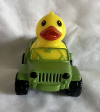 Yellow Rubber Duck in a Green Squeaking Jeep Ducking Dashboard Ornament picture