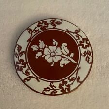 vintage compact, brick red/maroon color, attractive floral pattern  picture