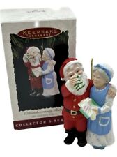 1994 Hallmark Keepsake A Handwarming Present Mr and Mrs Claus Ornament In Box picture