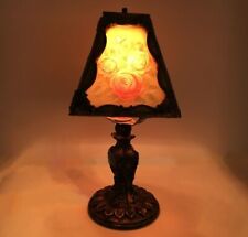 Pretty little boudoir lamp with hidden image. Carved roses light up when lit. picture