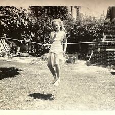 VINTAGE PHOTO 1947 little blonde girl hanging on rope balancing Original picture