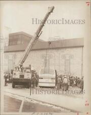 1978 Press Photo Crane Lifting Bus at Building Accident - ctaa29433 picture