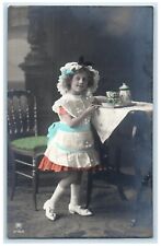 1910 Pretty Girl Bonnet Curly Hair Serving Tea RPPC Photo Antique Postcard picture