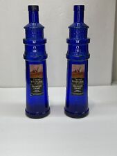 Truro Vineyards Of Cape Cod Cobalt Blue Lighthouse Empty Wine Bottles Set Of 2 picture