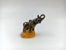 Metal Elephant Sculpture On Natural Baltic Amber Stone Decoration Animal Wild picture