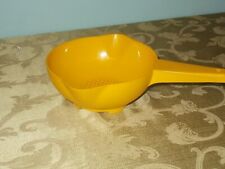 vintage yellow tupperware strainer picture
