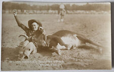 C 1920s RPPC A YOUNGER SLIM CASKEY RODEO COWBOY BULLDOGGING A STEER WRESTLING picture